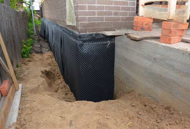 Happy homeowners after waterproofing job in Penfield